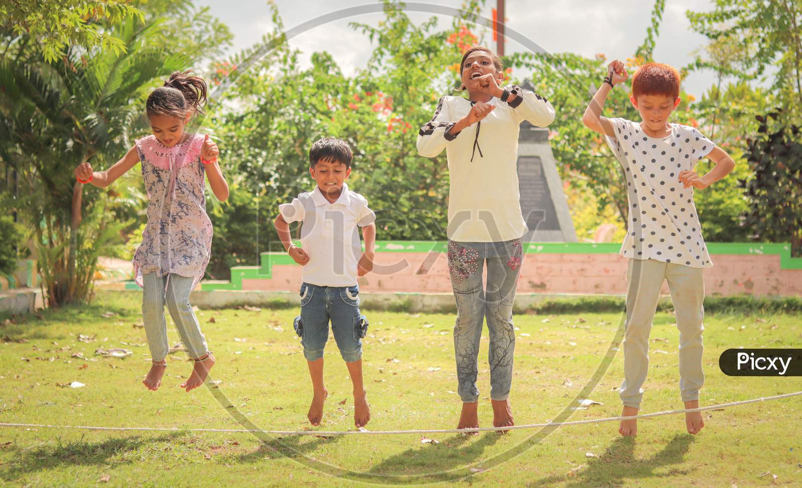 Children's Playing Traditional Games At a Park, Outdoors - Concept Of Kids Enjoying Outdoor Games In Technology-Driven World.