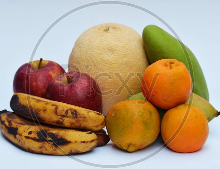 Muskmelon, Oranges, Mango, Banana And Apple.