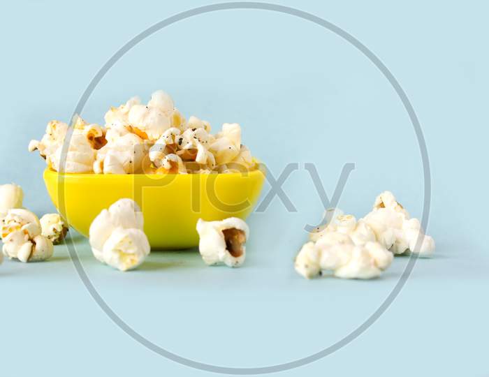 Pop Corns in a Bowl with blue Background