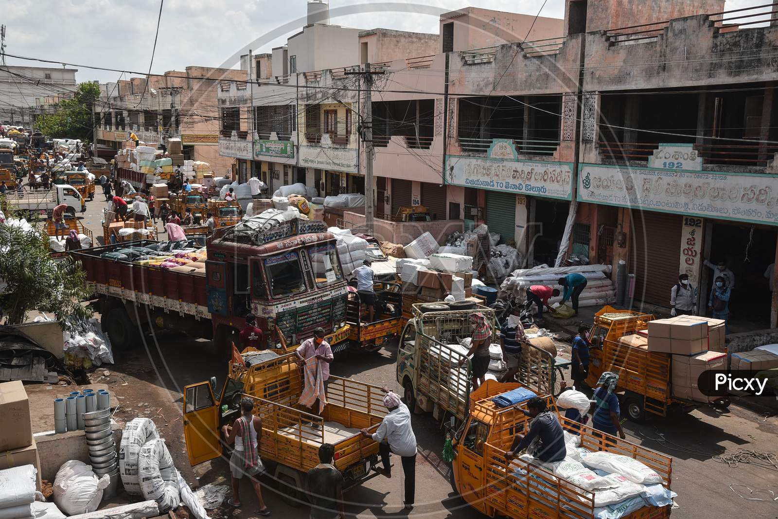 A view of a busy Mahatma Gandhi wholesale commercial market after authorities eased restrictions, during the fifth phase of coronavirus lockdown in Vijayawada.