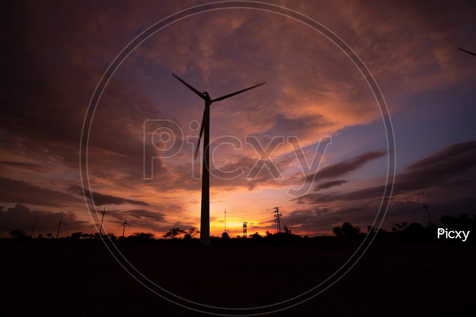 Silhouette Of A Windmill During Sunset