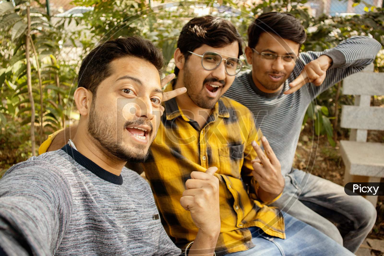 Group Of Friends Grimacing In Front Of The Camera - Young Happy People Having Fun At Park Making Funny Faces While Taking Selfie - Concept Of Millennials Addicted To Selfie, Technology And Mobile.