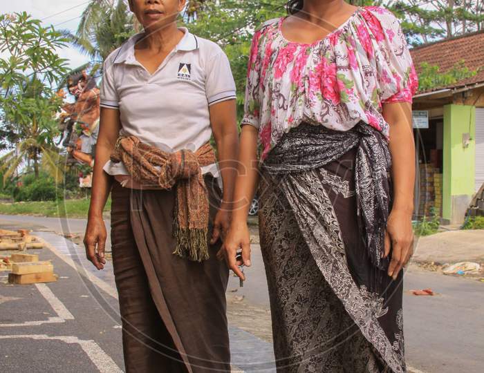 Local Women In Bali, Dressed In Batik