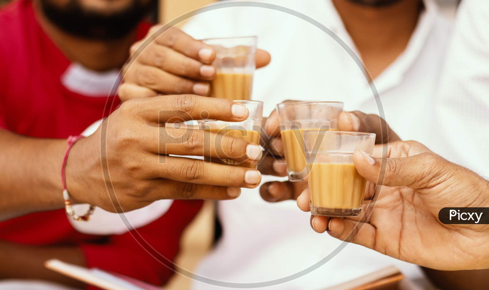 Close Up Of Hands Cheers Tea Glasses - Concept Showing Group Of Friends Enjoying Morning Tea By Cheering At Hotel.