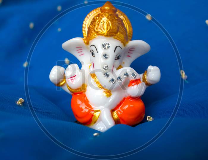 Lord Ganesha Idol with Blue Background
