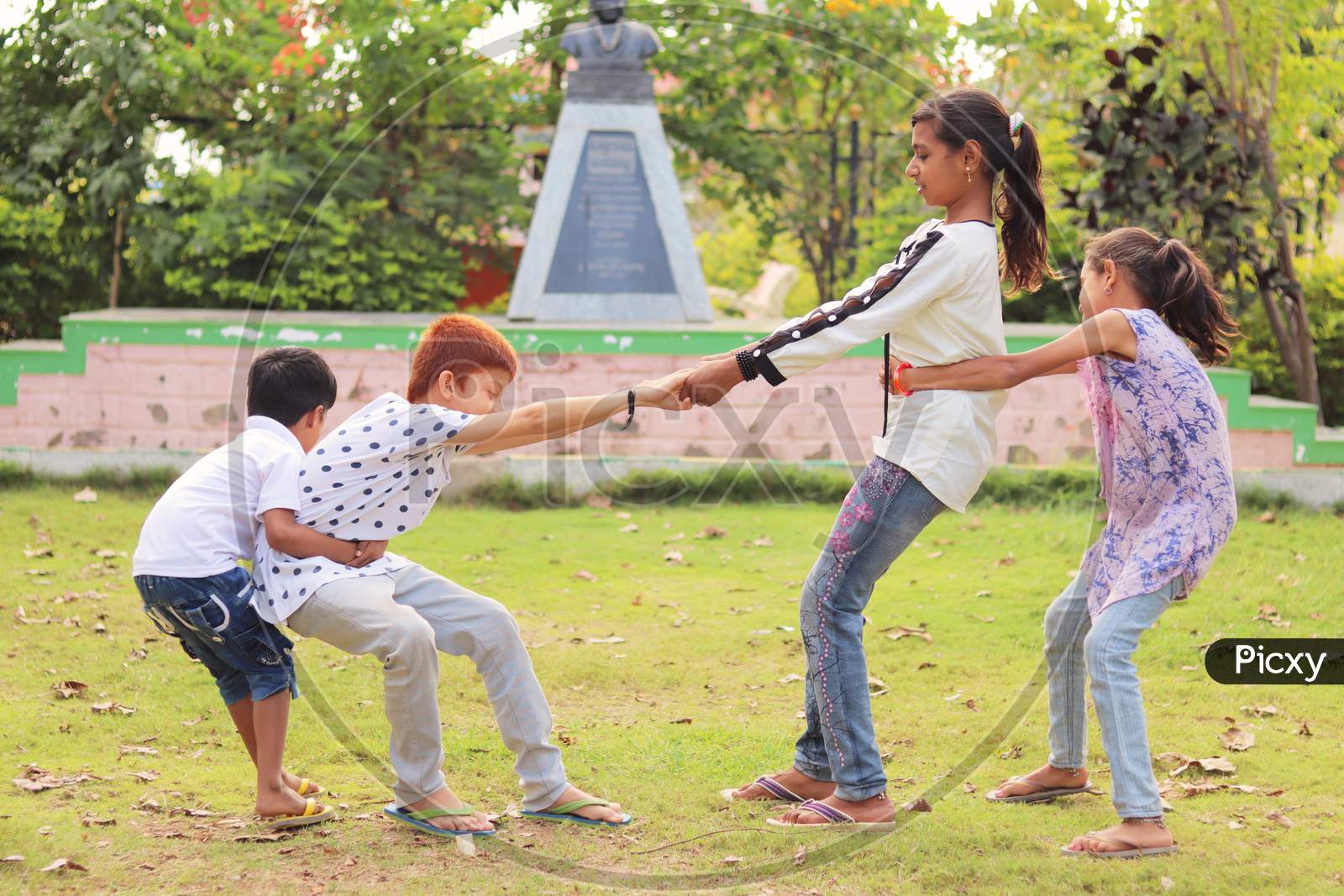 Children Playing Outdoor Games - Concept Of Kids Enjoying Outdoor Games In Technology-Driven World.