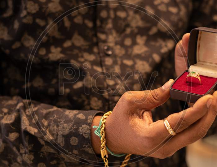 Close Up, Hands Showing Gold Chain At Jewelry Box With Copy Space At Jewellery Store