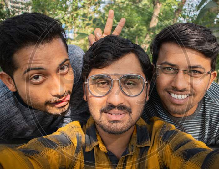 Group Of Happy Young College Students Taking a Selfie At University Campus