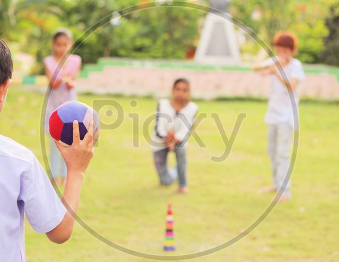 Children's Playing Games At Park, Outdoor - Kids Playing Traditional Games Outside During Leisure.
