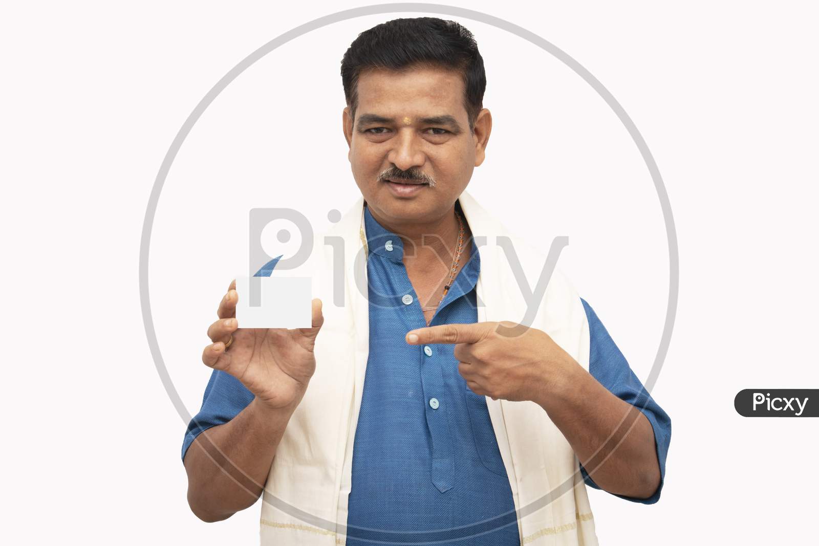 A Happy Indian Men in Traditional Dress pointing a Plain white card isolated with White Background