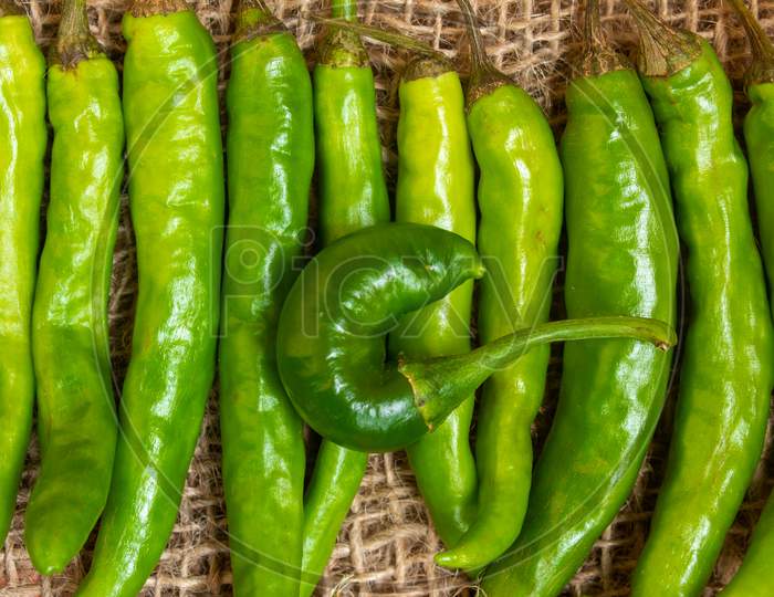 View Of Green Chilies In A Row
