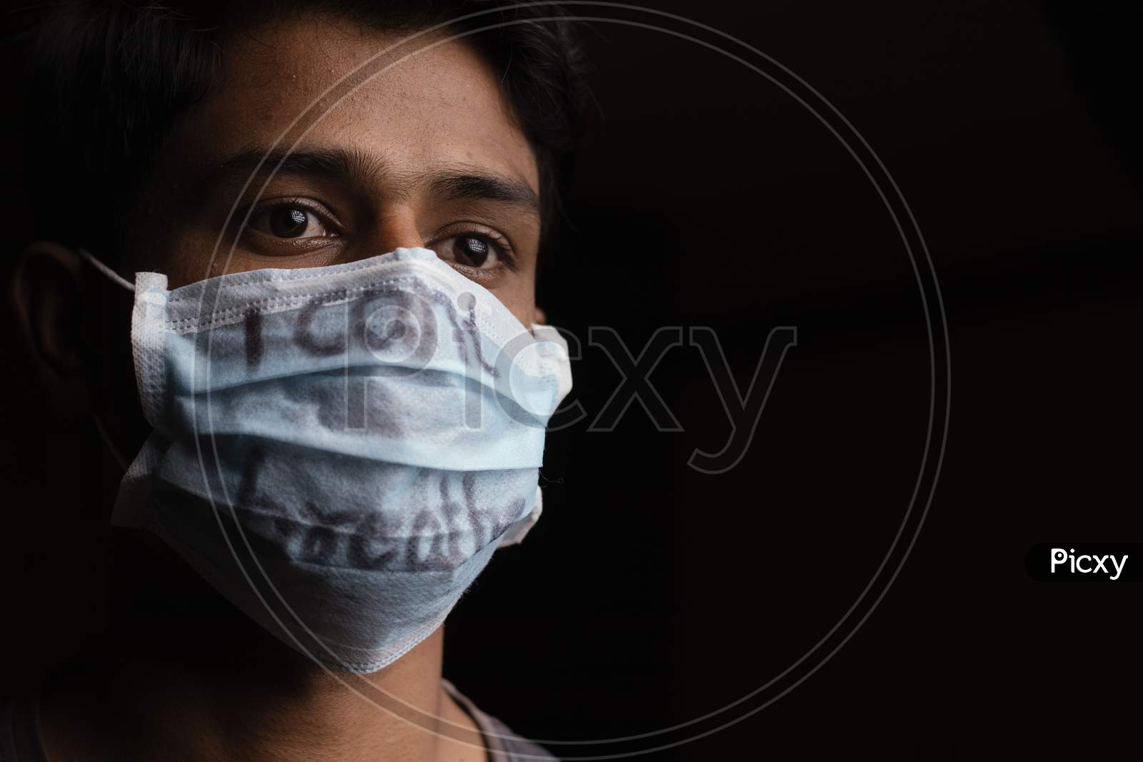Young Man With Wearing I Can'T Breathe Inscription On Medical Face Mask With Copy Space. Concept Of Protest About Human Right Of Black People In U.S. America