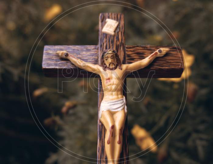 Wooden Crucifix Outside In A Garden