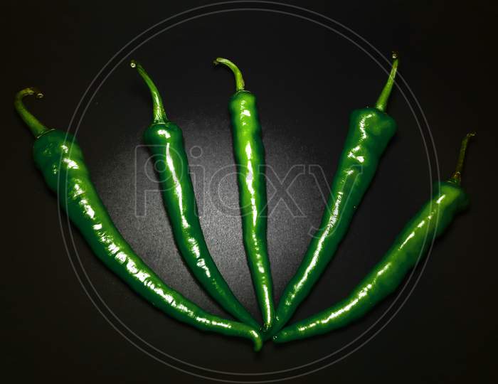 Green Chillies On Grey Black Background Stock Photos Images