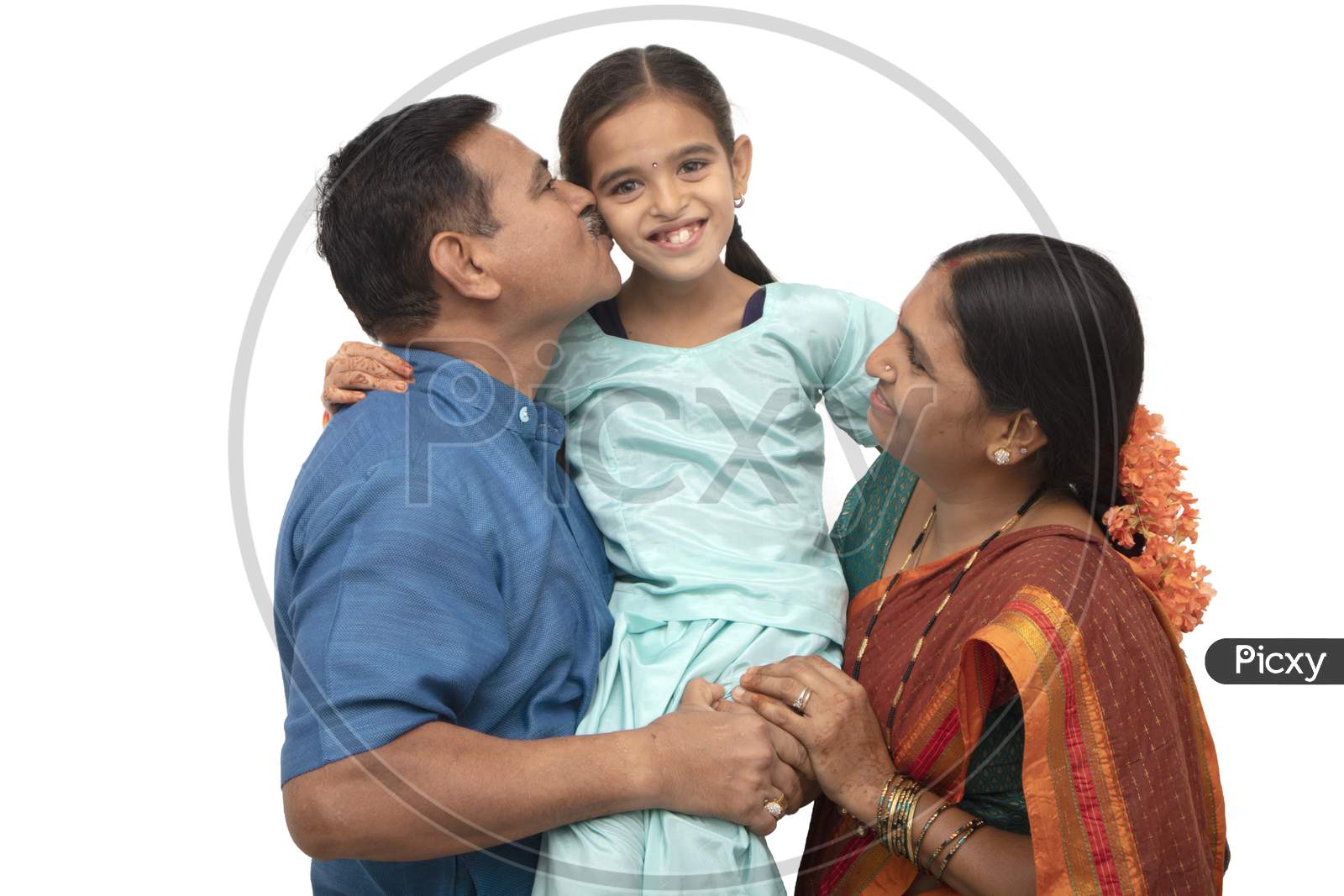 A Three Membered Happy Indian Family with a Kids Smiling Isolated with White Background