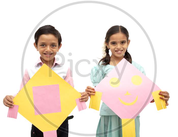 A Boy and Girl Holding Kits in Hands - A Indian Festival Sankranthi