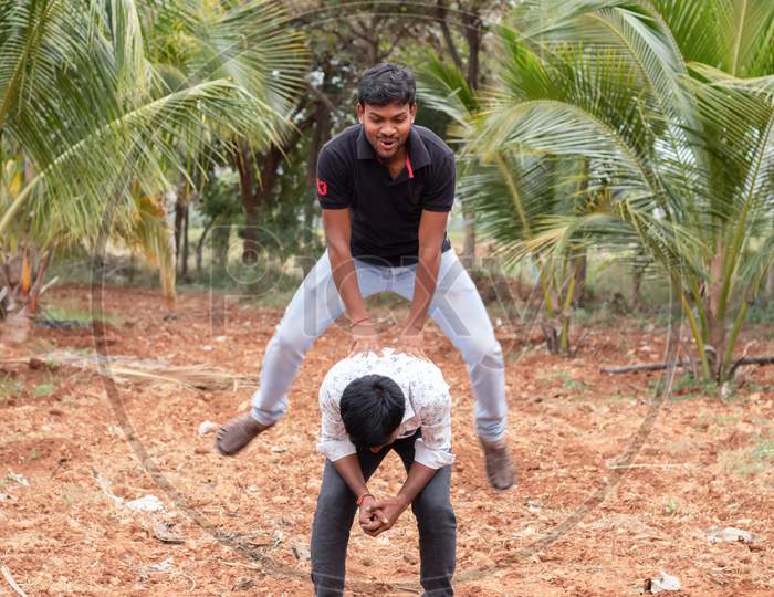 Young Indian people playing Outdoor Games