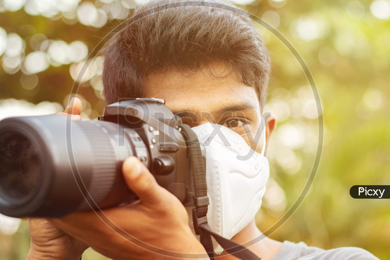 Young Photographer With Pollution Mask - Concept Of Photojournalism And Its Risk.