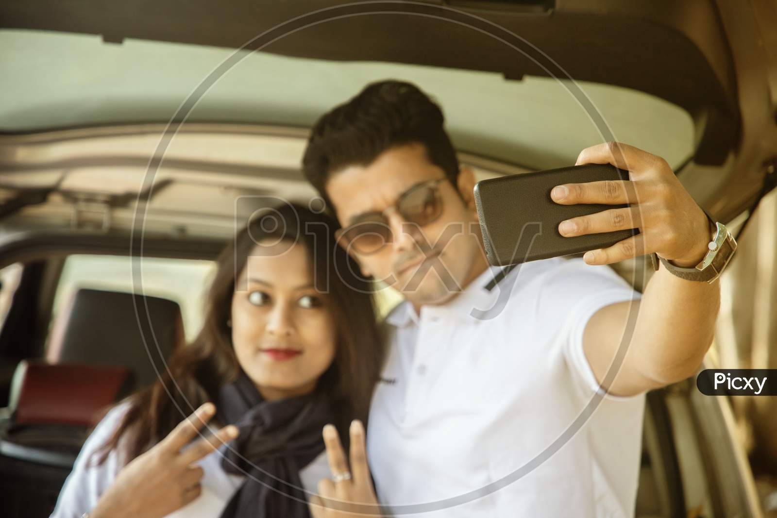 A Young Couple Taking Selfie with Smartphone or Mobile Phone