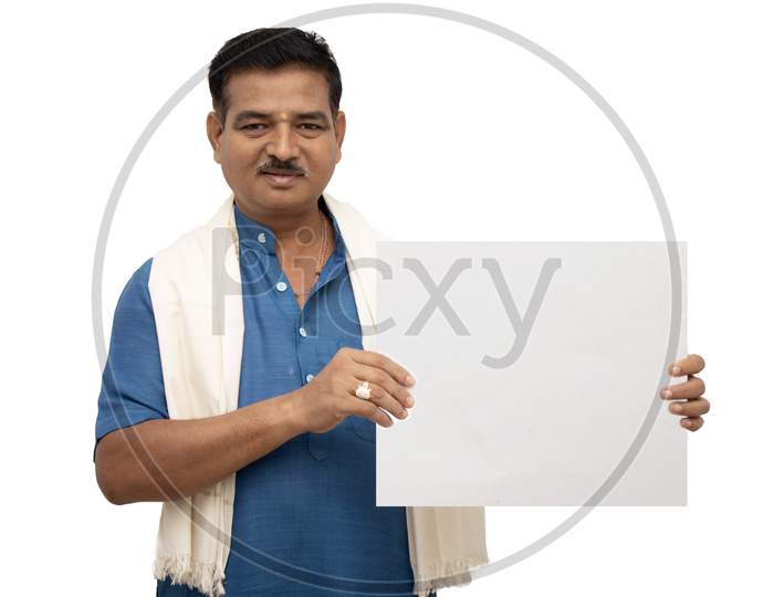 A Happy Indian Men in Traditional Dress Showing a Plain white Placard isolated with White Background