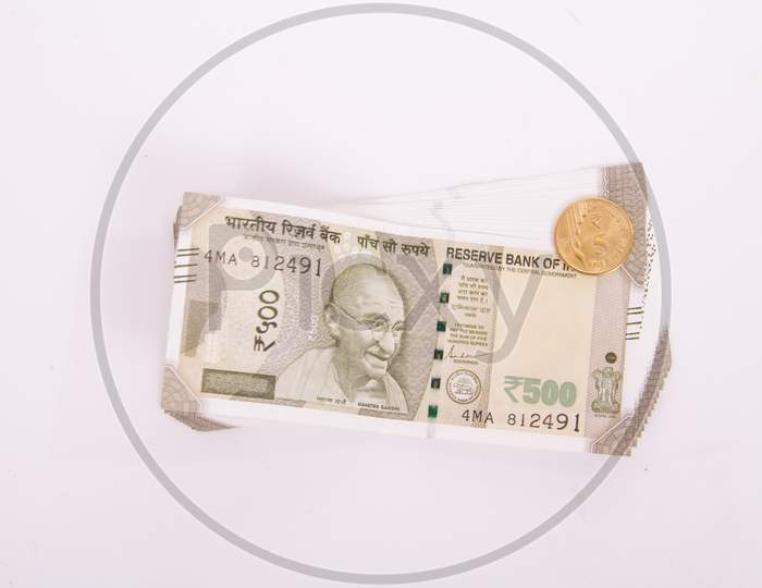 Five Hundred Rupees With New Indian Five Rupee Coin