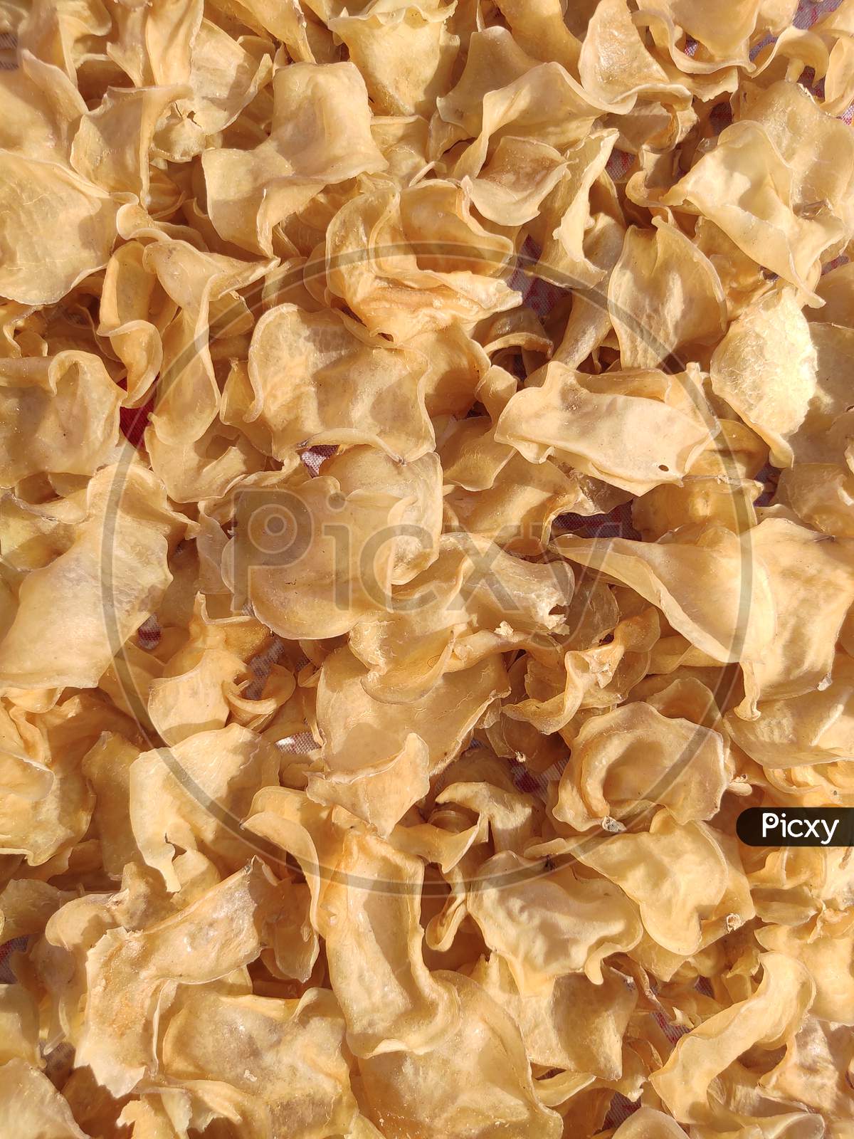 Uncooked sun dry potato chips slices top view