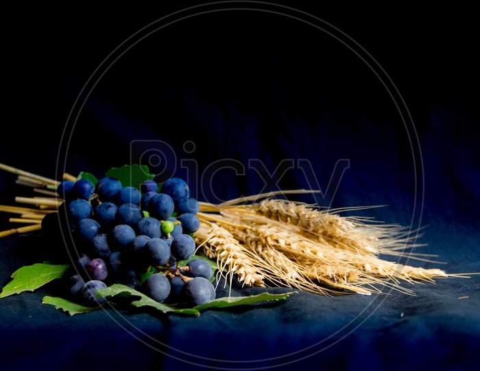 Wheat Grapes Bread And Crown Of Thorns On Black Background As A Symbol Of Christianity