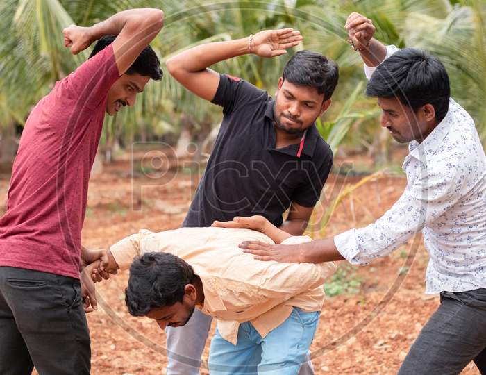 Group of Students fighting with Each other At an Outdoor Location