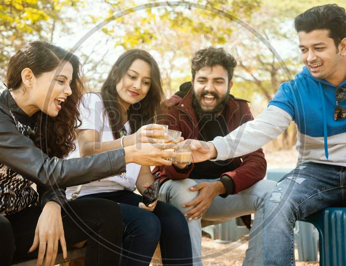 A Group of Happy Young People having Chai or Coffee At Outdoors