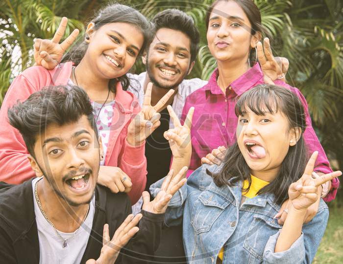 Young Teenage Friends Taking Selfie With Funny Faces - Concept Of Youth Happy Friendship Having Fun Together - Millennials Of Selfie Generation.