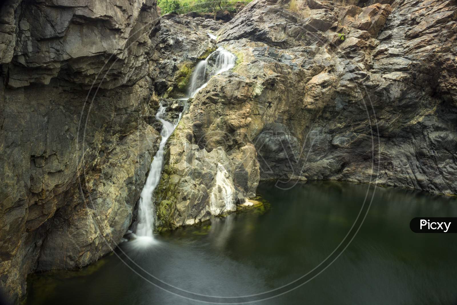 A gentle water falls in rocky terrain in Shivanasamudra
