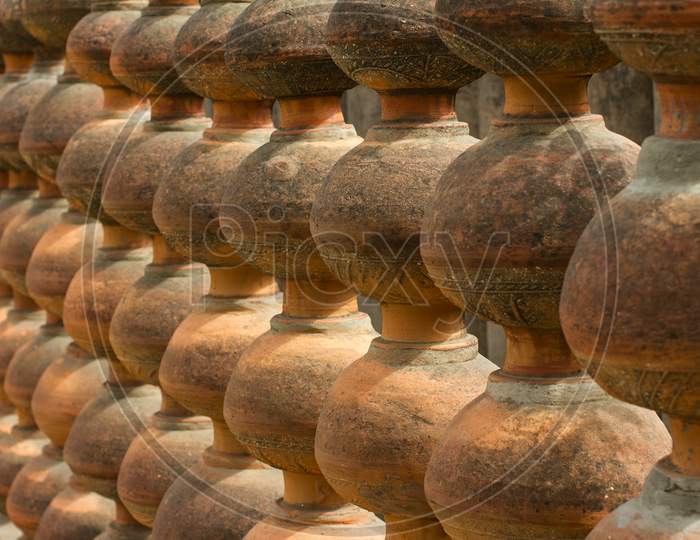 Close up shot of pots placed in sequence