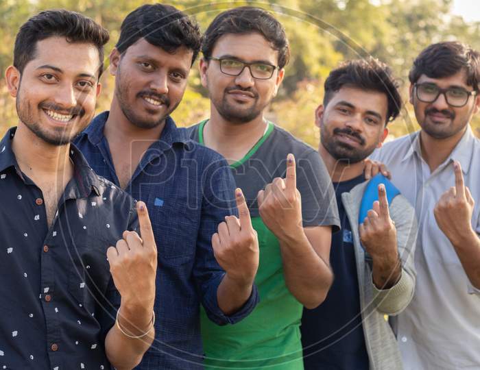 Group Of Young Indian Voters Showing Fingers After Casting There Votes.