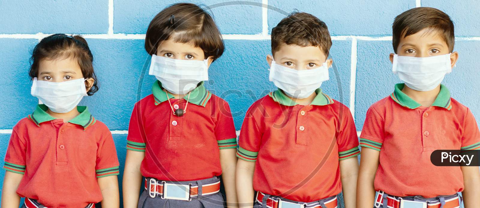 School Preteen Kids With Protection Face Mask Against New Coronavirus, Covid -19, Ncov 2019 Or Sars Cov 2 Virus At School - Children Wore Medical Mask Due To Coronavirus Outbreak.