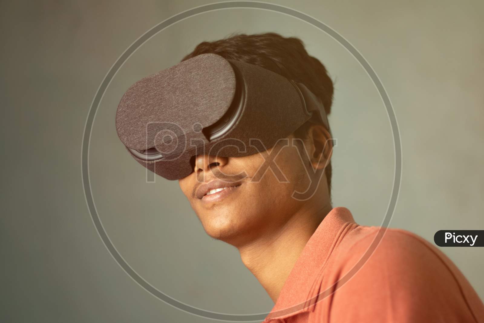 Portrait Of A Young Man Experiencing Virtual Reality Through A Vr Headset.