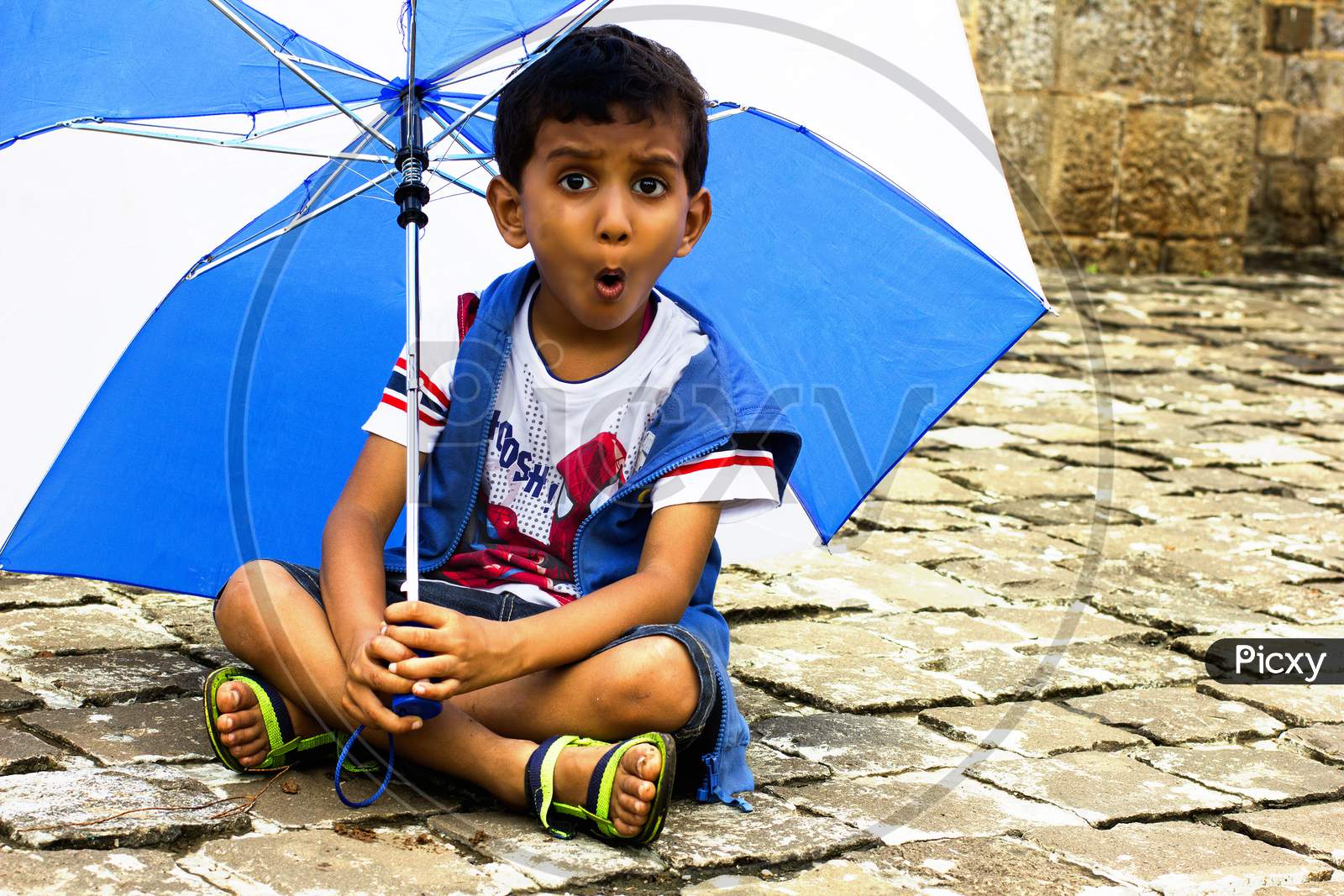 Portrait of a Young Indian Boy with an umbrella