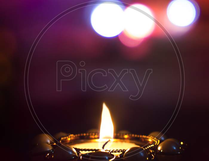 Close up shot of a Lightened Diya with Bokeh Background