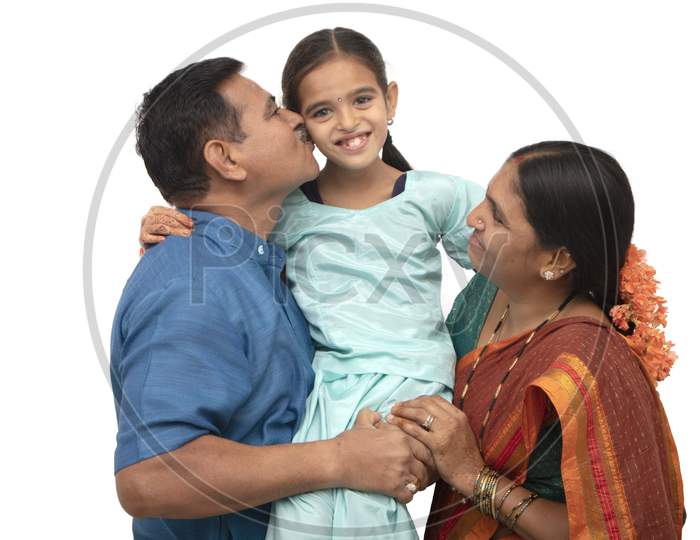 A Three Membered Happy Indian Family with a Kids Smiling Isolated with White Background