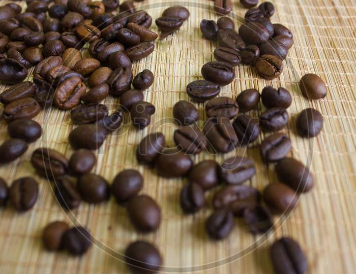 Close up shot of Coffee Beans with Textured Background