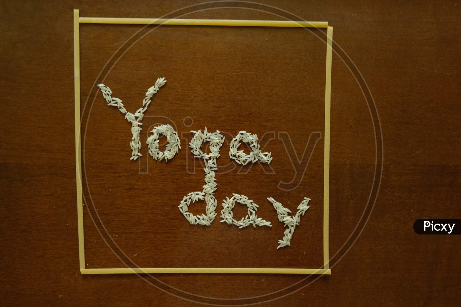 Yoga day text with spaghetti on a dark background