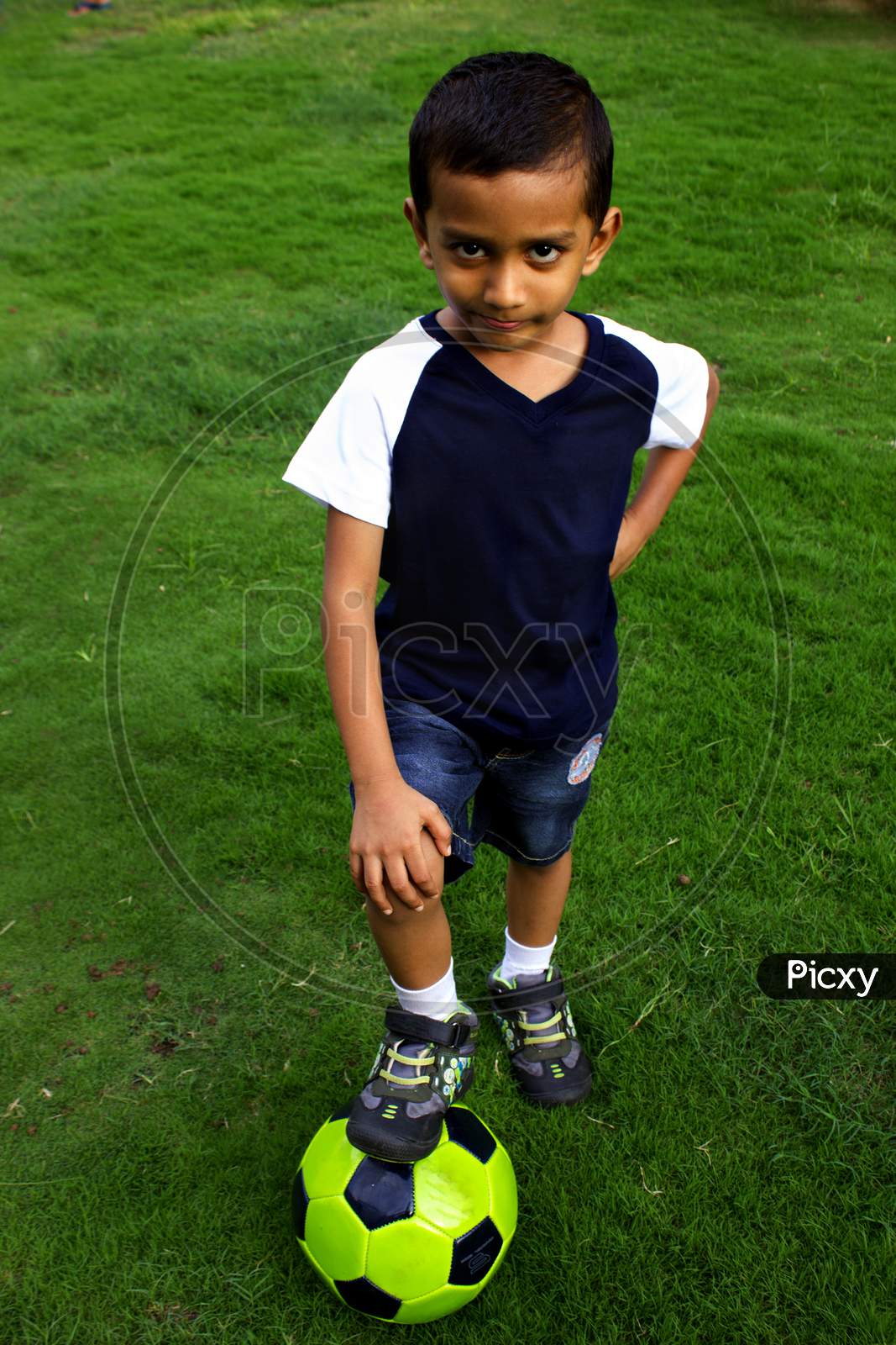 Portrait of a Young Indian Boy with a Football