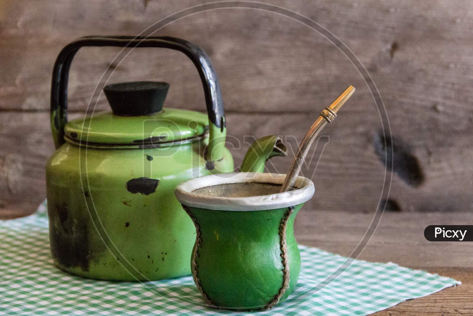 Mate And Kettle, Traditional Argentine Yerba Mate Infusion, On Rustic Wooden Background