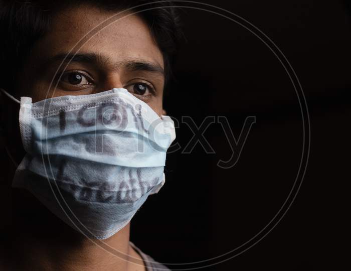 Young Man With Wearing I Can'T Breathe Inscription On Medical Face Mask With Copy Space. Concept Of Protest About Human Right Of Black People In U.S. America