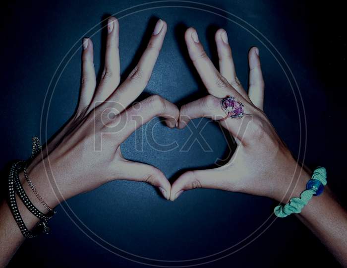 Hand Sign Heart Shaped Fingers In Grey Blue Background Stock Photos Images