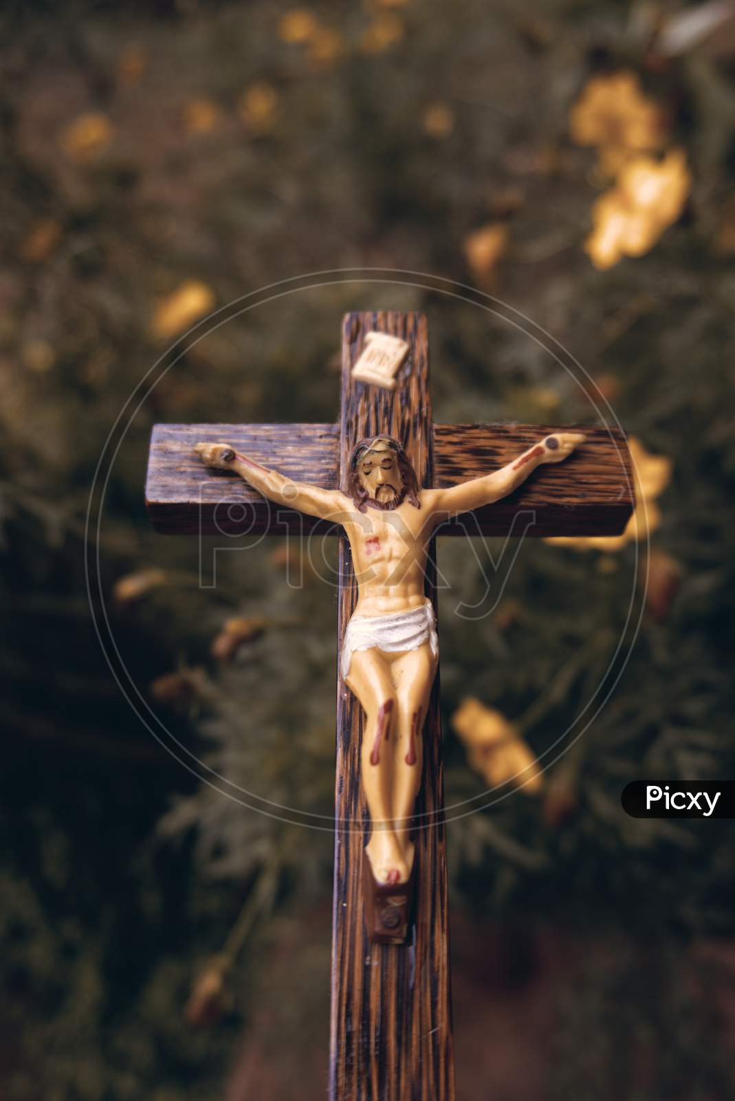 Wooden Crucifix Outside In A Garden