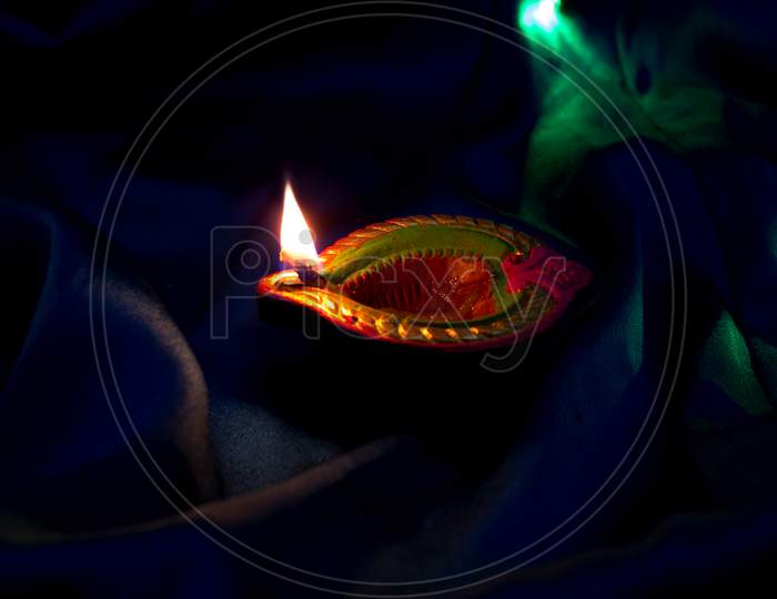 A Lightened Diya A Concept of Happy Diwali Greetings
