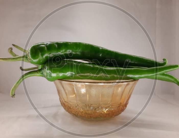 Green Chilli On Glass Bowl