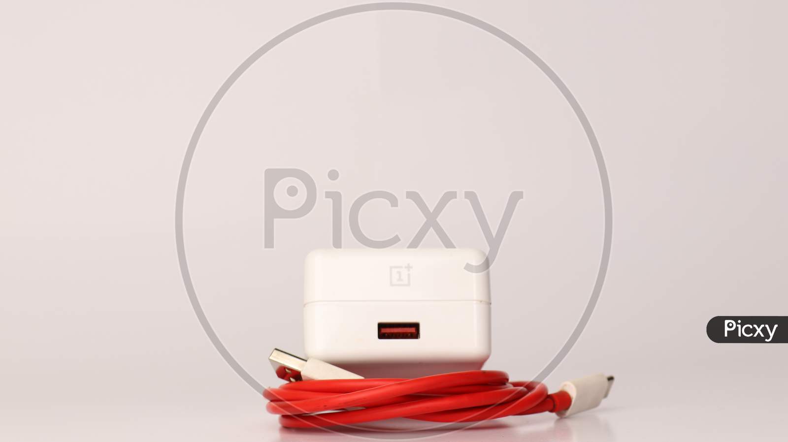 OnePlus dash charger with red cable