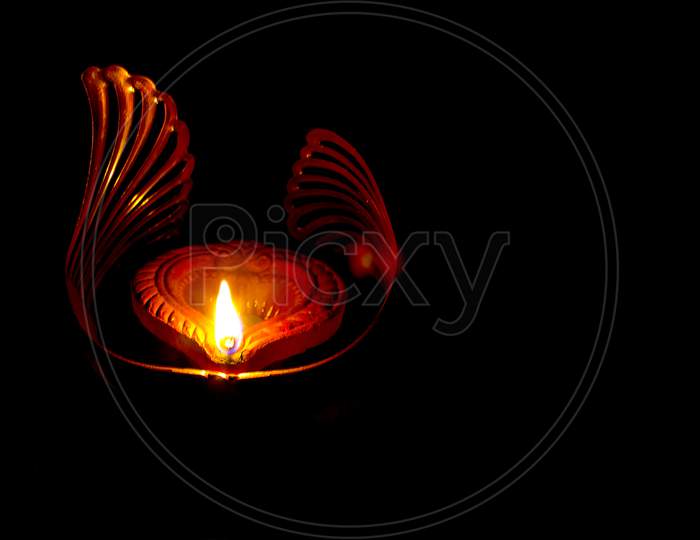 Close up shot of a Lightened Diya A Concept of Happy Diwali Greetings