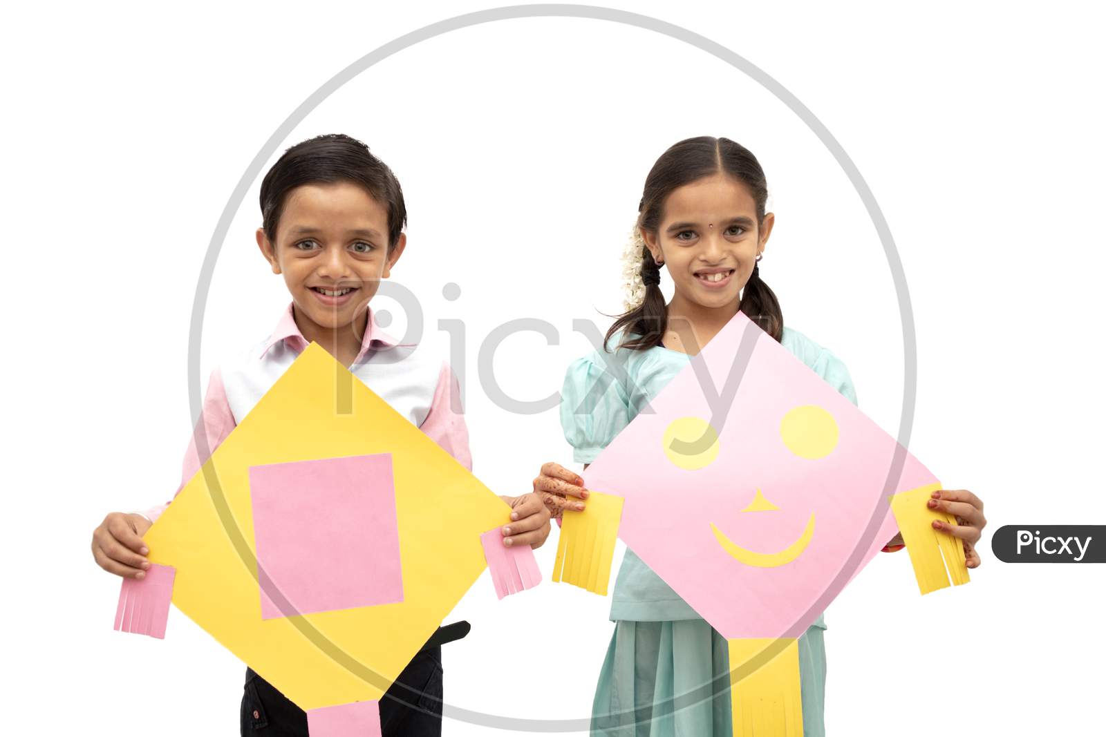 A Boy and Girl Holding Kits in Hands - A Indian Festival Sankranthi